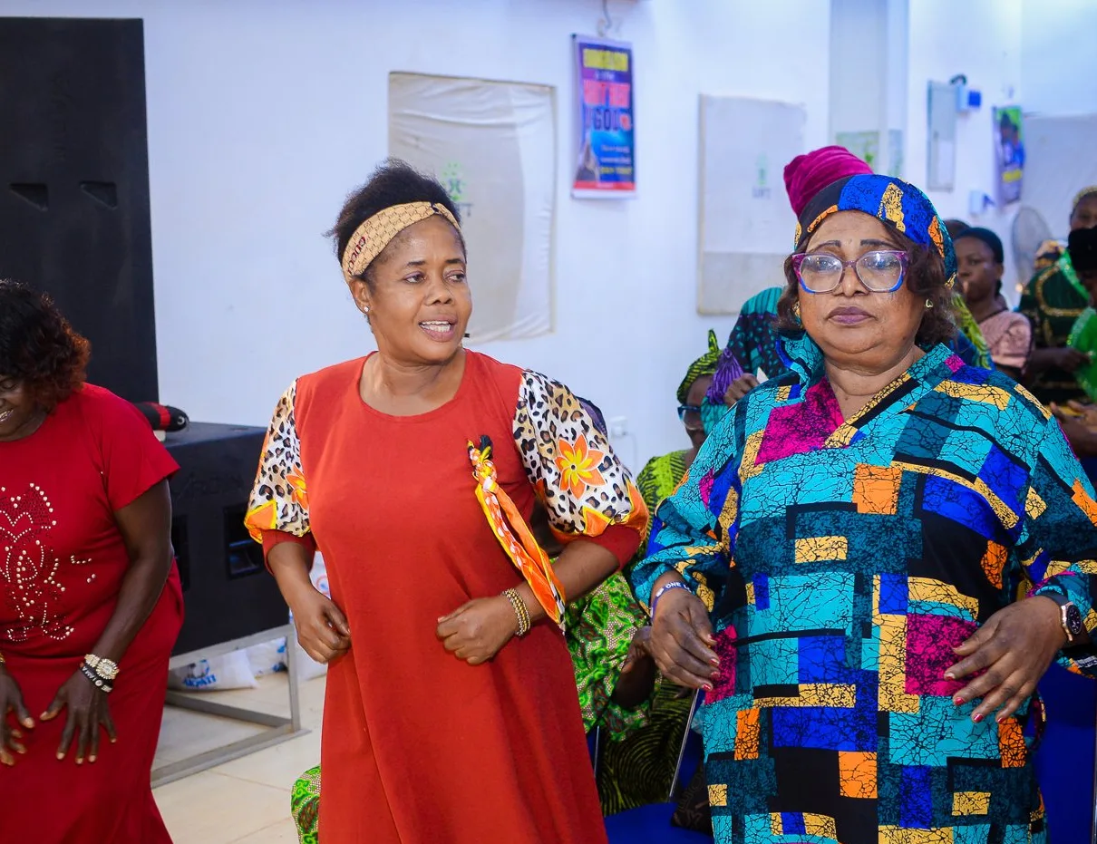 Women dance together at the Foundation&rsquo;s widows&rsquo; outreach in Akute.