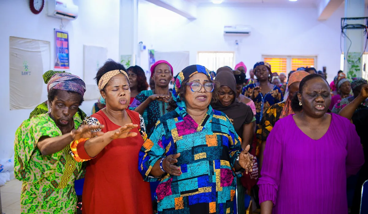 Women sing and pray together at the Foundation&rsquo;s widows&rsquo; outreach in Akute.