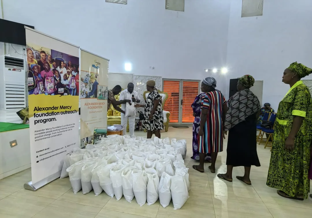 Women queuing for bags of food at a Foundation outreach.